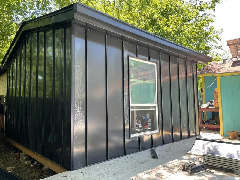 Black standing seam metal wall panels for Roof Inspection in South Houston